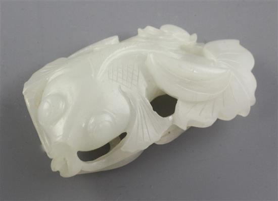 A Chinese white jade carving of a goldfish amid lotus, late 19th / early 20th century, 6.4cm